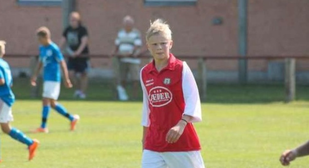 Young Erling Haaland wearing Bryne FK's red and white kit during a youth football match